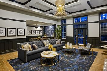 A living room with a couch and tables